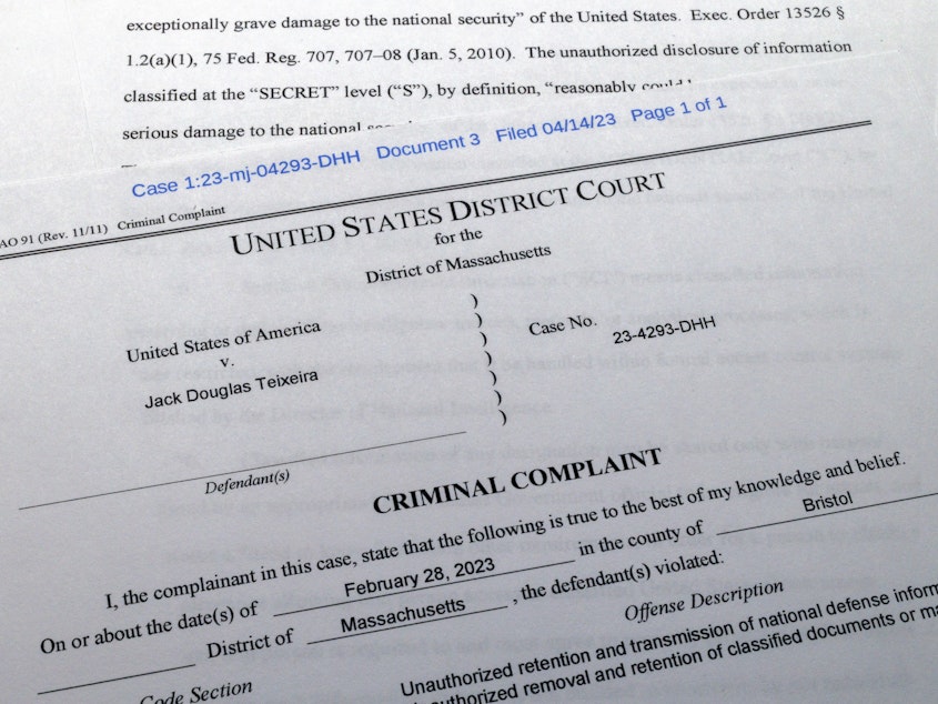 caption: The criminal complaint against Massachusetts Air National Guardsman Jack Teixeira is photographed on April 14.