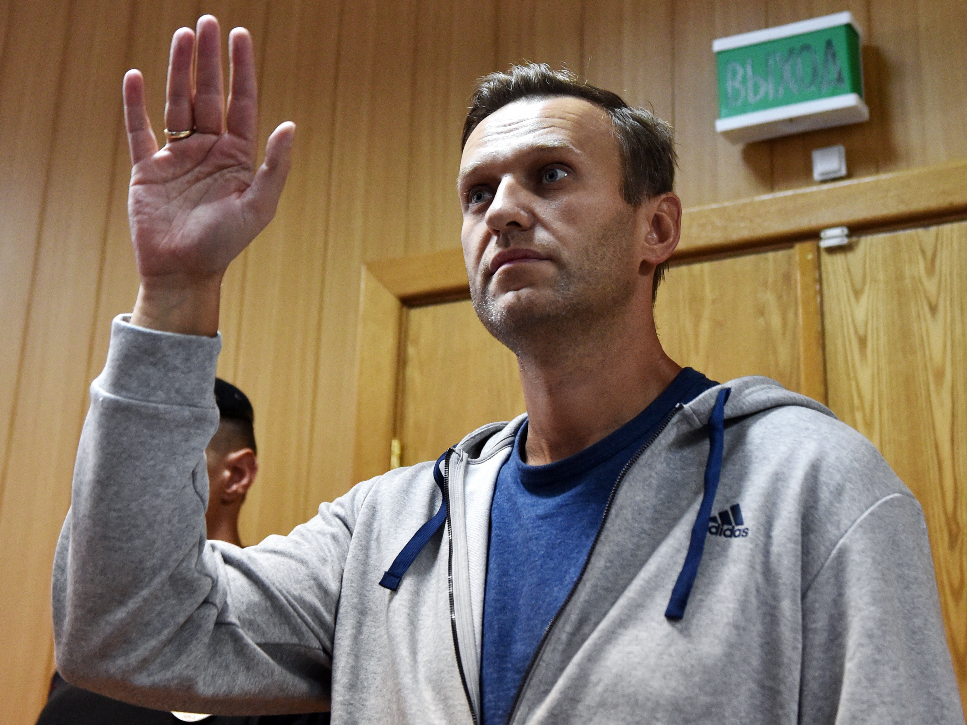 caption: Russian opposition leader Alexei Navalny gestures during his trial at a Moscow courthouse on August 27, 2018.