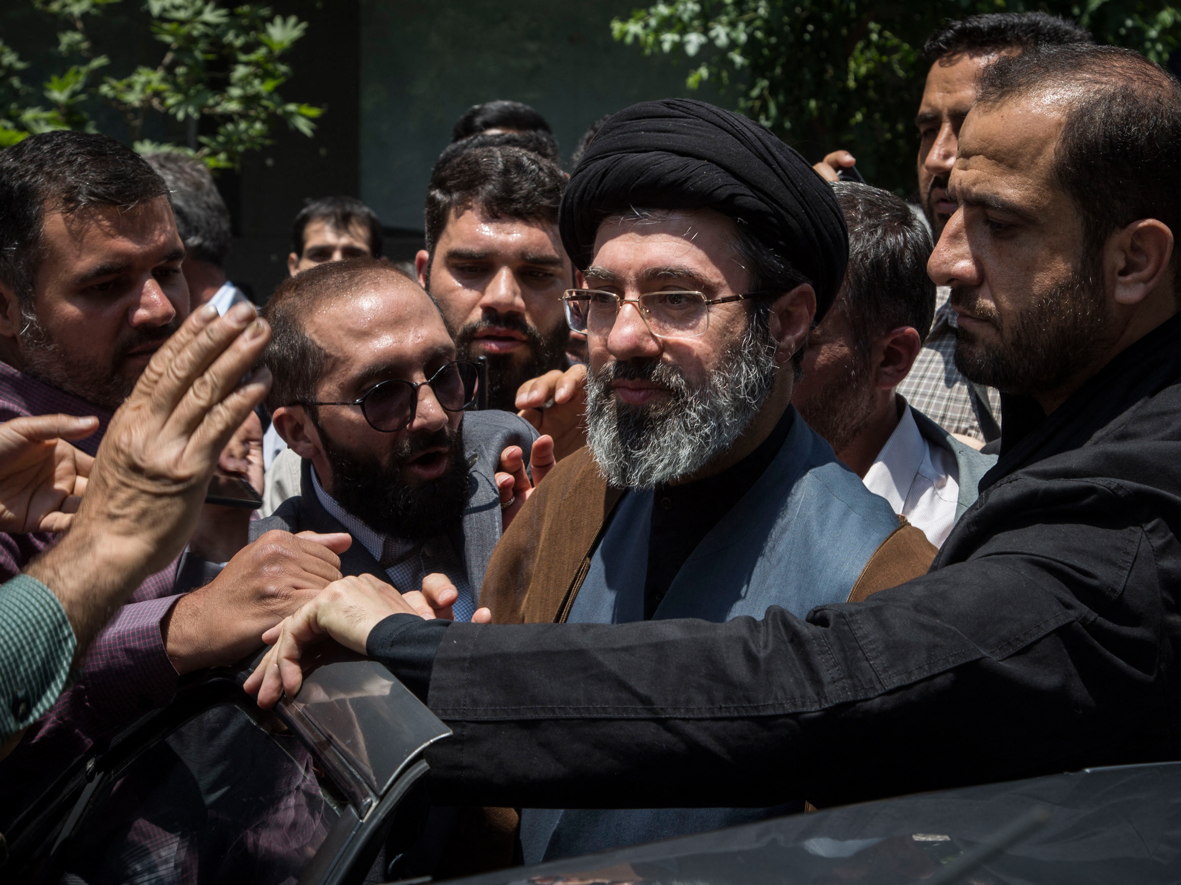 caption: Mojtaba Khamenei (center), the son of the killed Ayatollah Ali Khamenei, participates in the annual Quds Day rally in Tehran, Iran, on May 31, 2019. (Photo by Rouzbeh Fouladi / Middle East Images / AFP via Getty Images)
