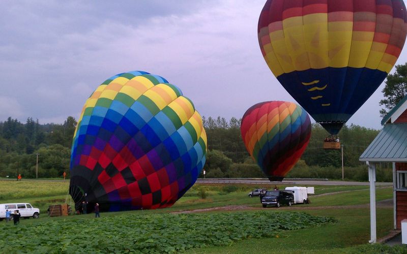 caption: Ballooning Snohomish provides at least two flights a day, seven days a week. Because of wildfire smoke, their balloons haven't moved in over ten days.