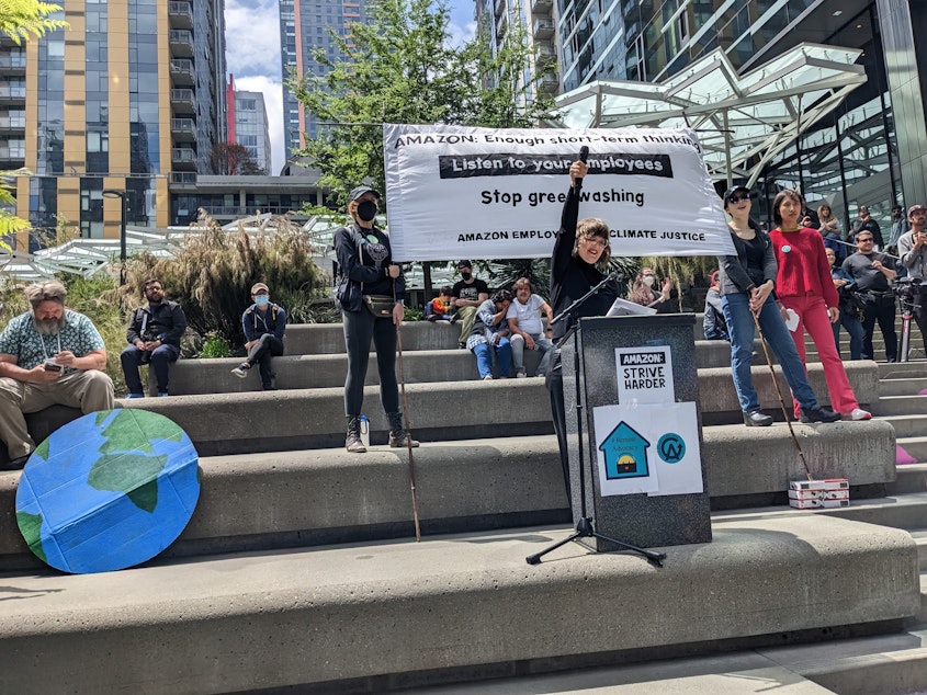 caption: Former Amazon Employee Emily Cunningham speaks at a walkout protesting the company's carbon footprint and return-to-office policy.
