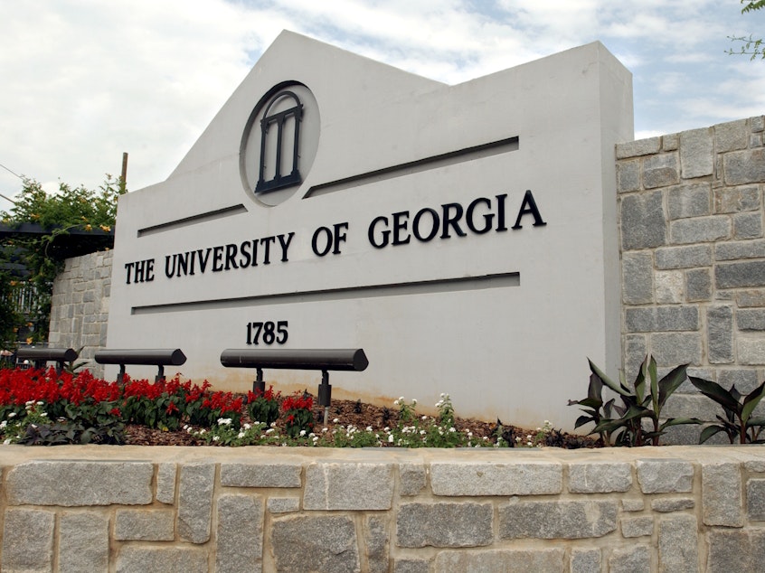 caption: A sign for the University of Georgia is seen, May 28, 2004, in Athens, Ga. A woman was found dead Thursday, Feb. 22, 2024, on the campus of the University of Georgia after a friend told police she had not returned from a morning run, the university said.