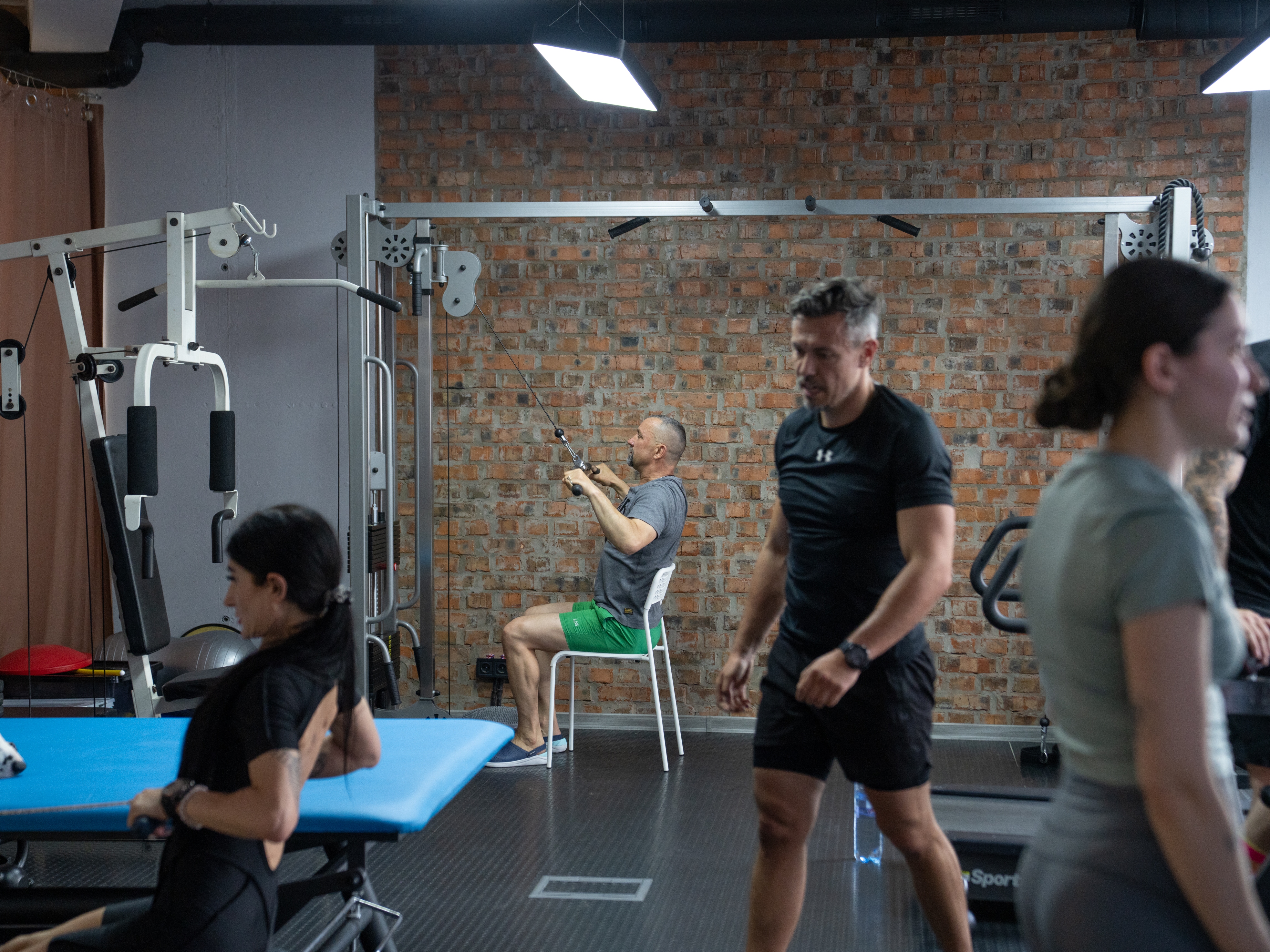 caption: Andriy Khrystiuk exercises during a CrossFit class at the Lviv Habilitation Center where he's staying to recover from mental trauma that he is experiencing as a result of serving in Ukraine's military.
