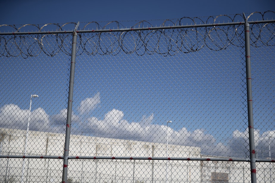 caption: A fence outside of the Northwest Detention Center, recently renamed the Northwest ICE Processing Center, is shown on Tuesday, September 10, 2019, in Tacoma. 