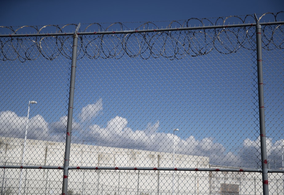 caption: A fence outside of the Northwest Detention Center, recently renamed the Northwest ICE Processing Center, is shown on Tuesday, September 10, 2019, in Tacoma. 
