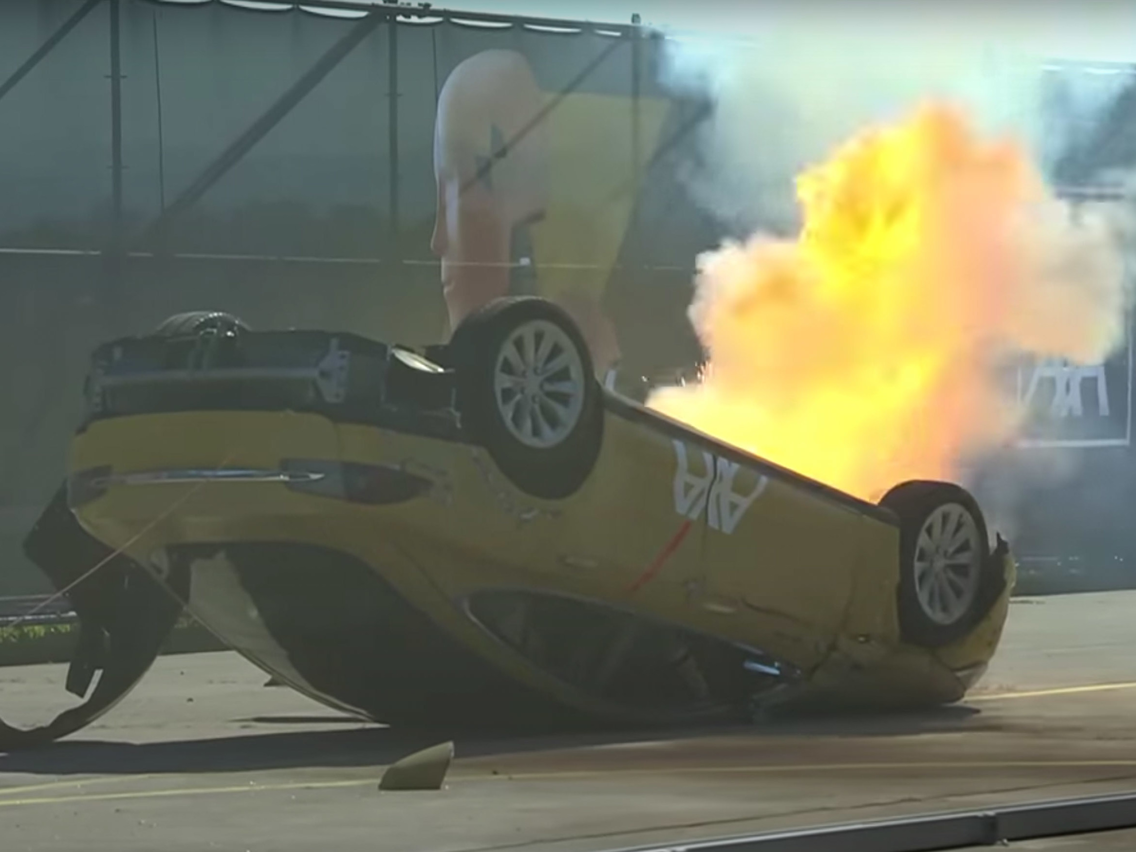 caption: The insurance firm Axa said it regretted that its crash test of a Tesla, in which the front half of the car burst into blames, caused confusion, and the company admitted that electric vehicles don't catch fire any more often than combustion-engine automobiles.