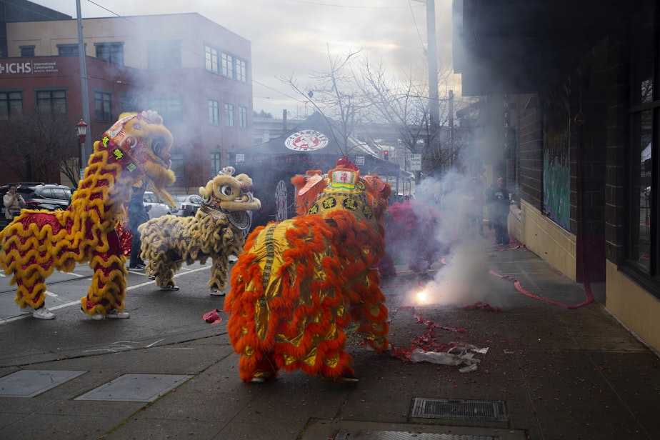 caption: Mak Fai Dragon and Lion dancers perform during the Lunar New Year celebration on Saturday, Feb. 4, 2023, in Seattle’s Chinatown-International District. 