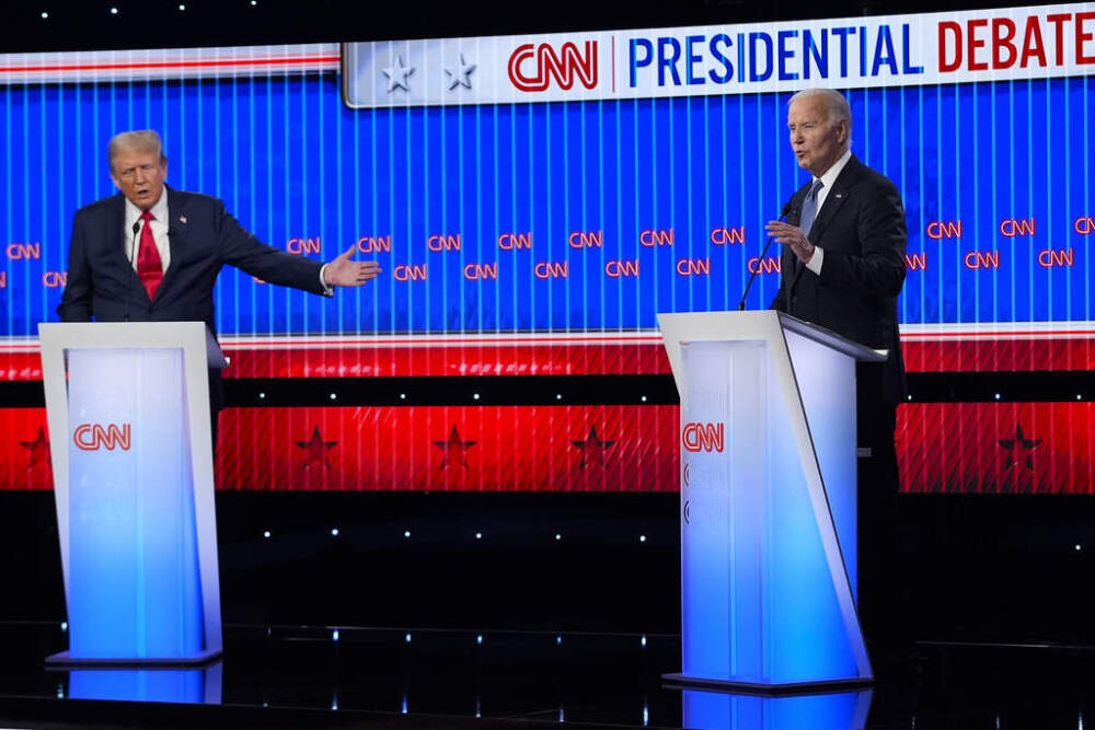 caption: Republican presidential candidate former President Donald Trump, left, and President Joe Biden, right, speak simultaneously during a presidential debate hosted by CNN, Thursday, June 27, 2024, in Atlanta. (Gerald Herbert/AP)