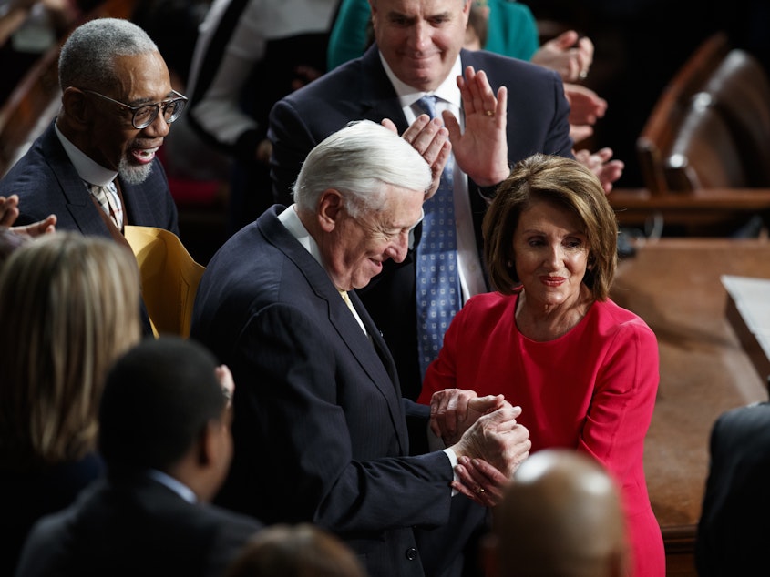 caption: New Speaker of the House Nancy Pelosi, D-Calif., and Steny Hoyer, D-Md., are applauded at the Capitol on Thursday as Democrats officially regain control of the chamber.