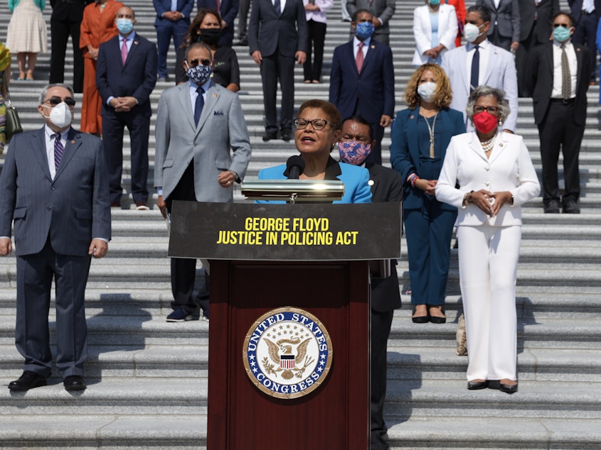 caption: Rep. Karen Bass, D-Calif., lead author of the George Floyd Justice in Policing Act, speaks during an event on police reform last year at the U.S. Capitol.