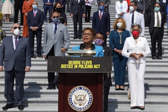 caption: Rep. Karen Bass, D-Calif., lead author of the George Floyd Justice in Policing Act, speaks during an event on police reform last year at the U.S. Capitol.
