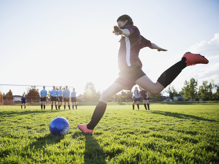 caption: Participation in team sports as a teen may help protect against the long-term mental health effects of childhood trauma.