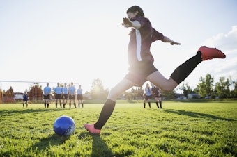 caption: Participation in team sports as a teen may help protect against the long-term mental health effects of childhood trauma.