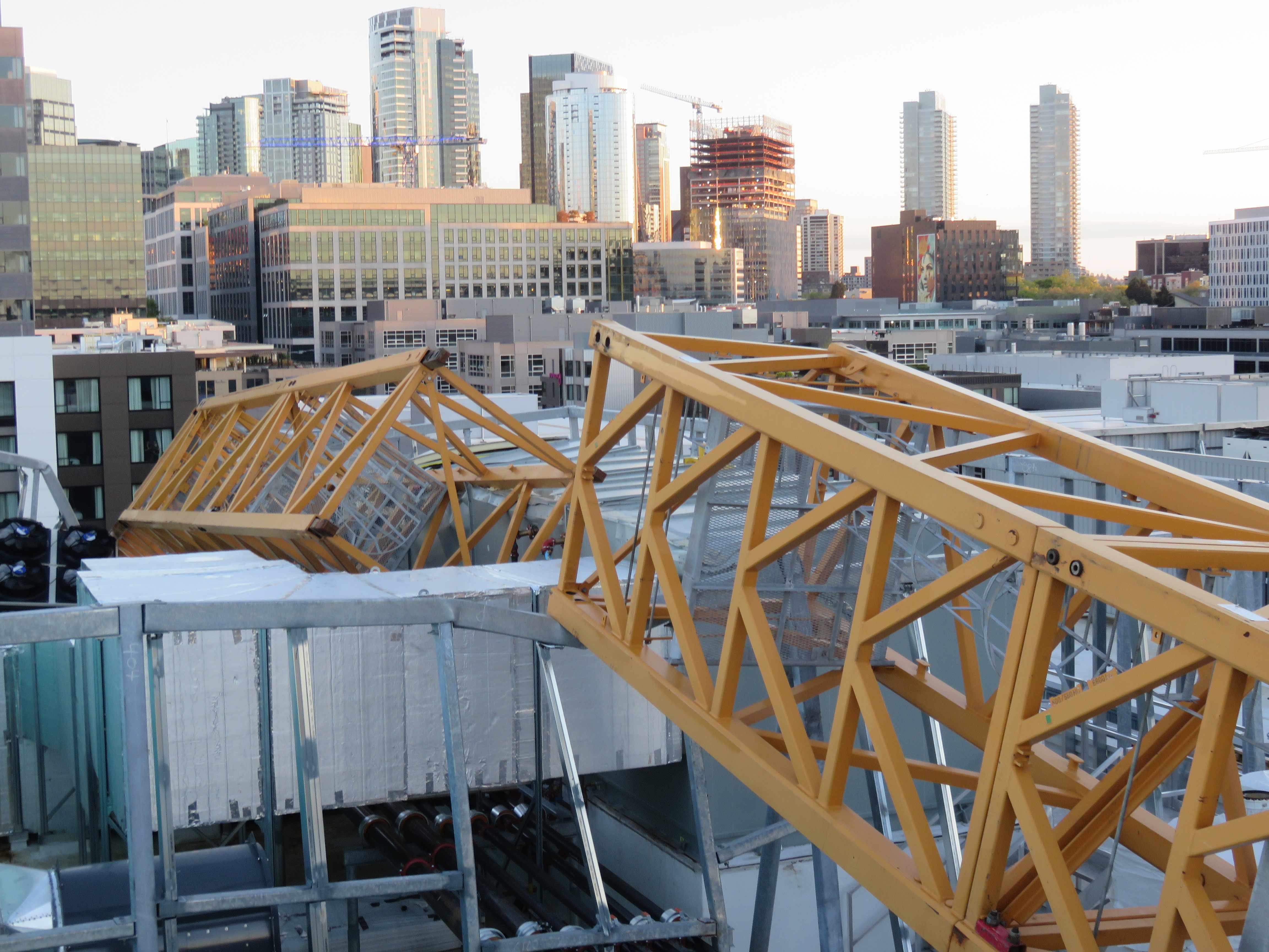 caption: The fallen crane, with holes where essential pins had been removed prematurely