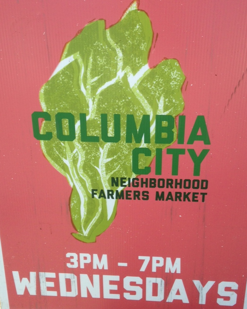 caption: A sign for the farmers market.