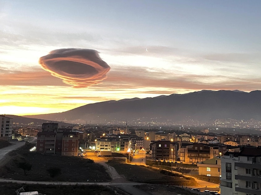 caption: Saucer-like lenticular clouds appear over Turkiye's Bursa province in the early morning hours of January 19, 2023.