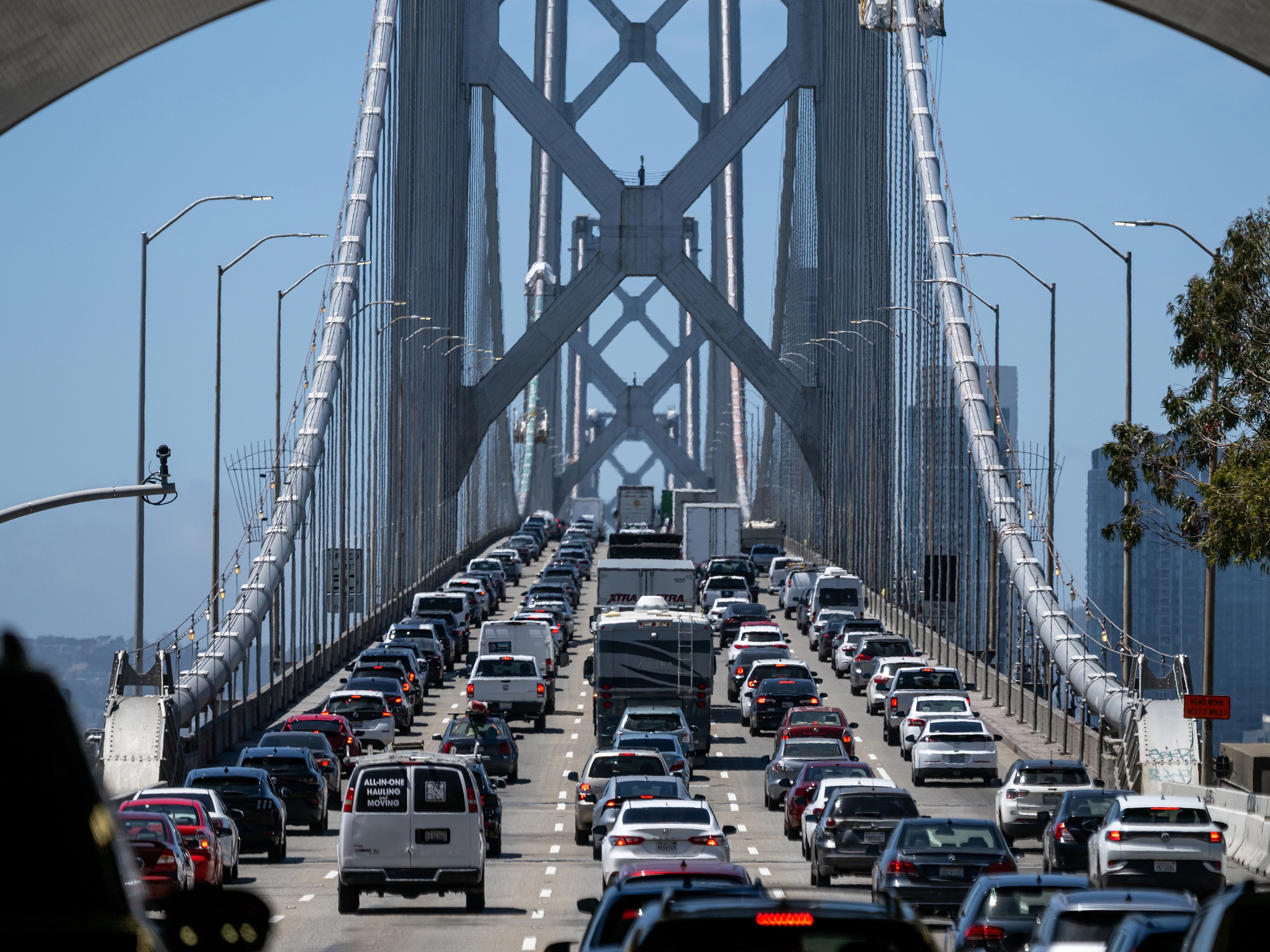 caption: Traffic crosses the Oakland San Francisco Bay Bridge in California on Thursday, kicking off what's expected to be a congested Memorial Day Weekend.