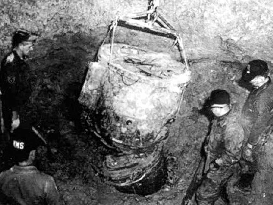 caption: Four of the men from Jack ReVelle's team observe the retrieval of the second hydrogen bomb's parachute pack.