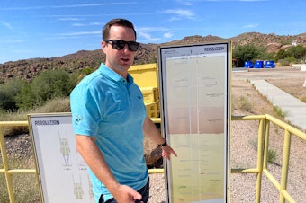 caption: Tyson Nansel, spokesperson for the Resolution Copper mine, shows how the copper is about 6,800 feet underground. To process the copper, the mine will use billions of gallons of local water and stored Colorado River water.