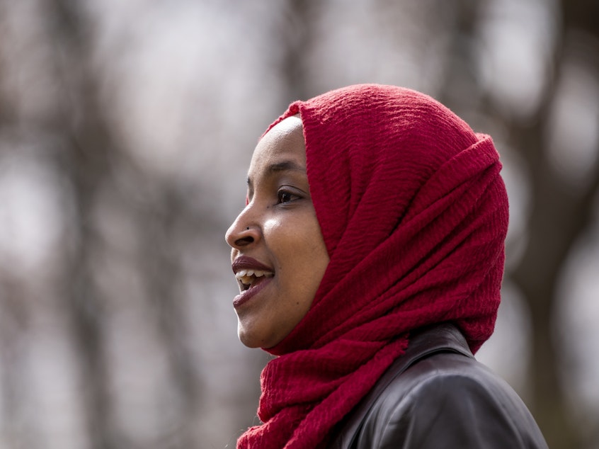 caption: Rep. Ilhan Omar, D-Minn., seen here at a press conference in April, issued a clarification Thursday of comments she made that appeared to equate the United States and Israel to Hamas and the Taliban.