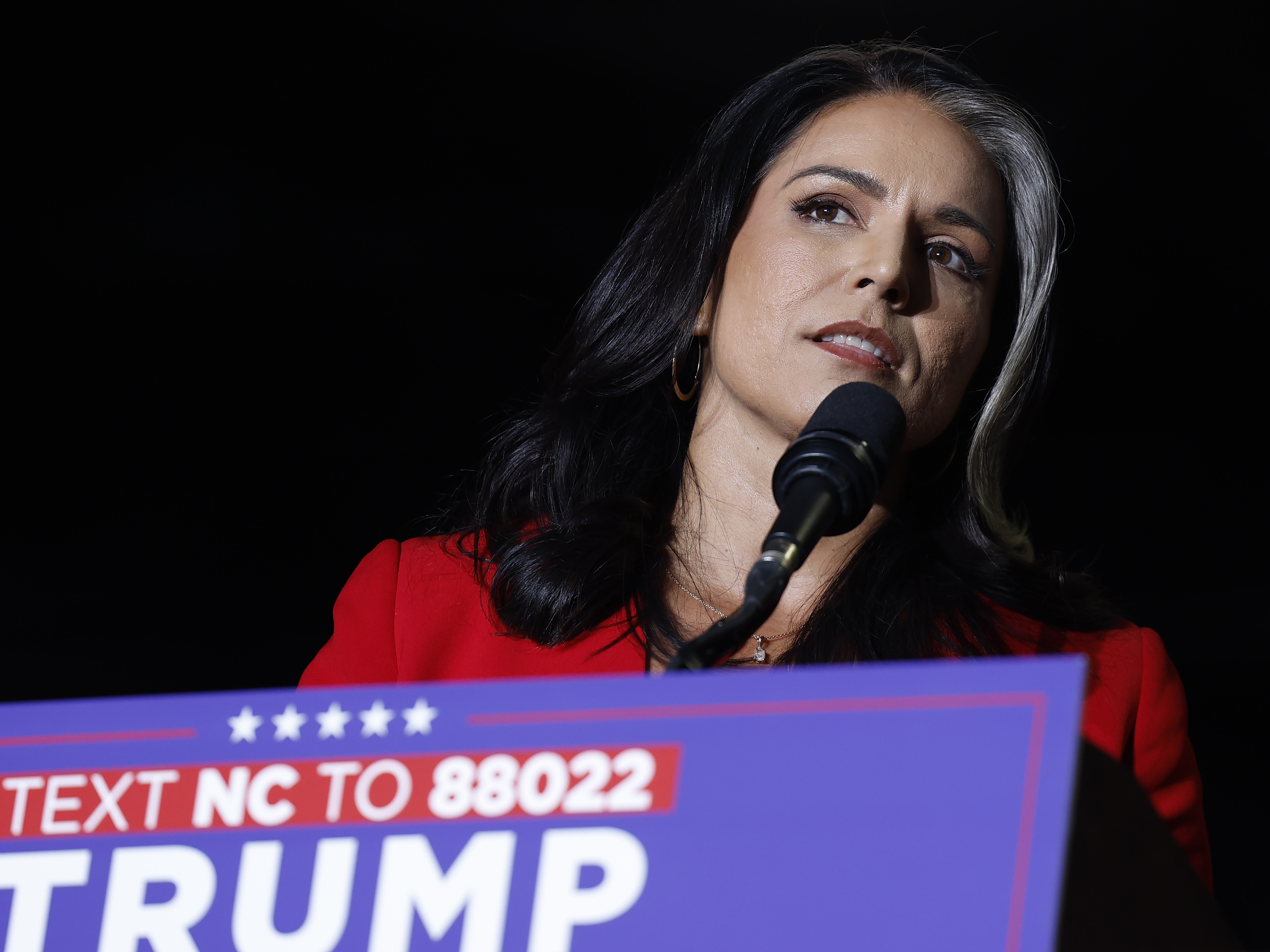 caption: Former U.S. Rep. from Hawaii Tulsi Gabbard speaks during a rally for former President Donald Trump on Oct. 22 in Greensboro, N.C.