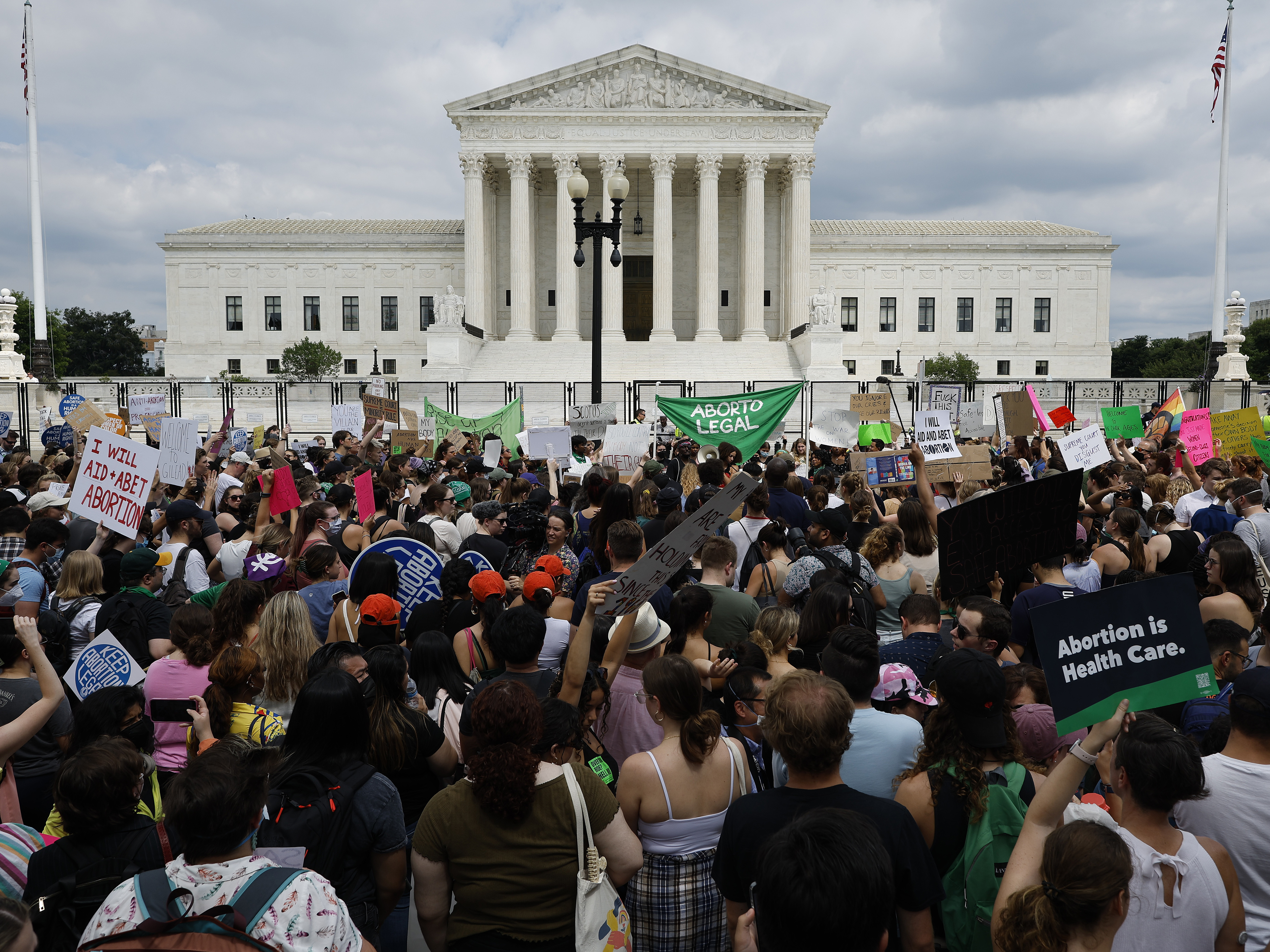 caption: Thousands of abortion-rights activists gather in front of the U.S. Supreme Court after it overturned the landmark <em>Roe v Wade</em> case and erased a federal right to an abortion.