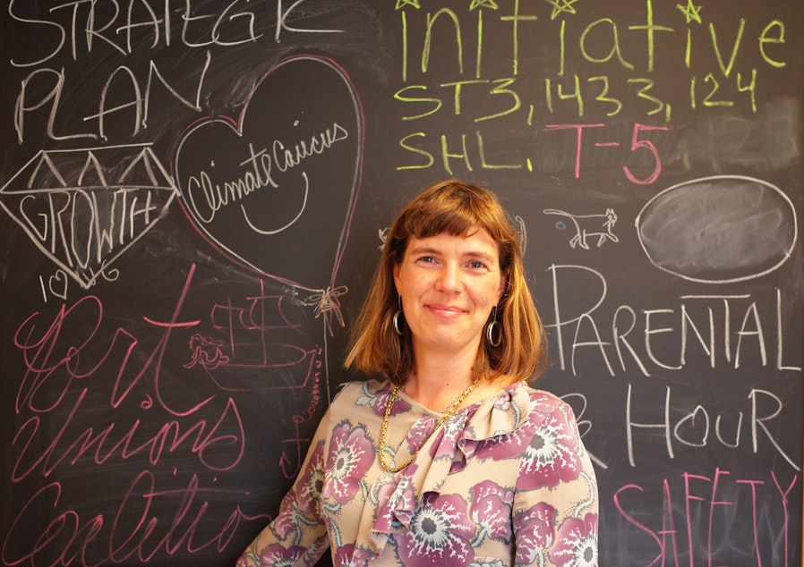 caption: Nicole Grant of the Martin Luther King Labor Council has a blackboard decorated with the initiatives and issues supported by the local labor movement.