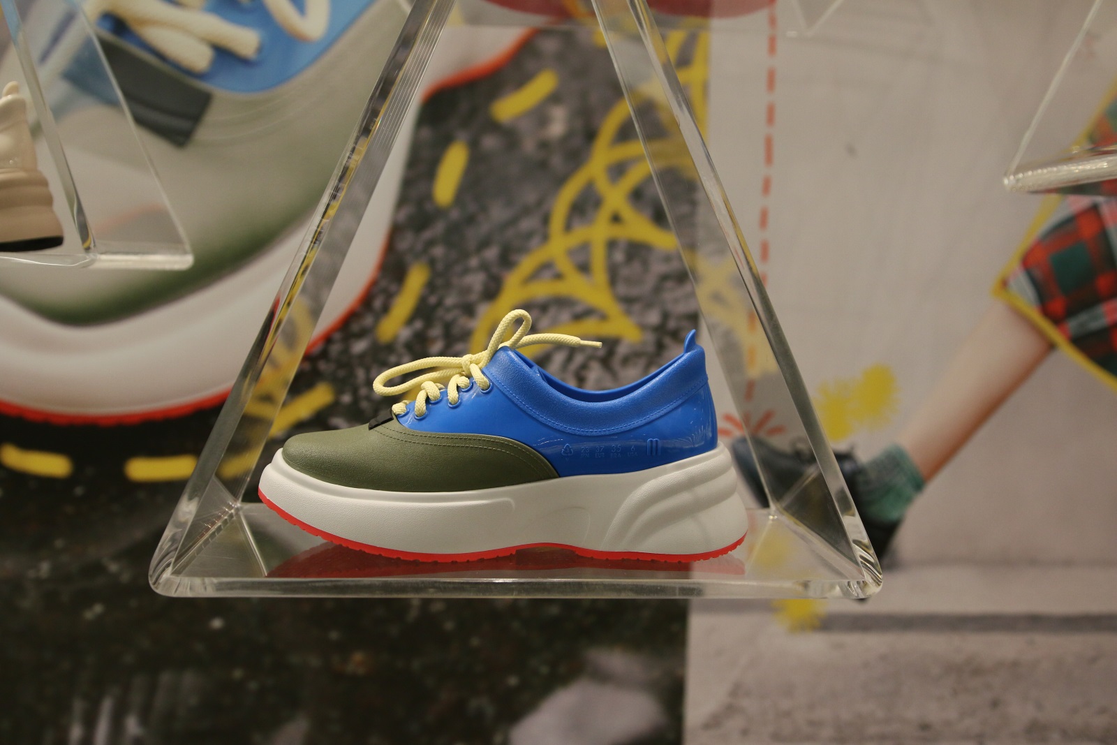 caption: These plastic shoes are bubble gum scented, on display at Galeria Melissa in New York City, November 16, 2018.