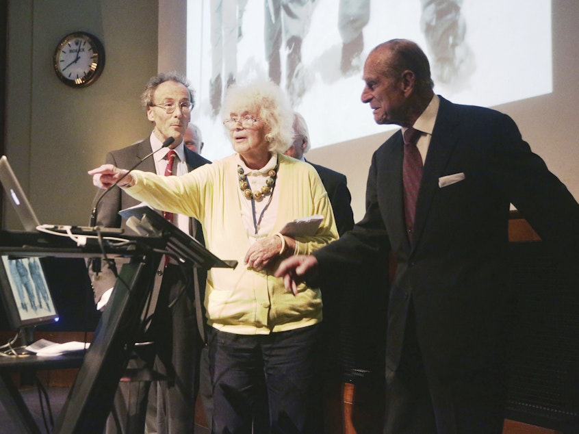 caption: In this May 29, 2013 file photo, travel writer, journalist and author, Jan Morris, center, with the Duke of Edinburgh, right, during a reception to celebrate the 60th Anniversary of the ascent of Everest, at the Royal Geographical Society in London.