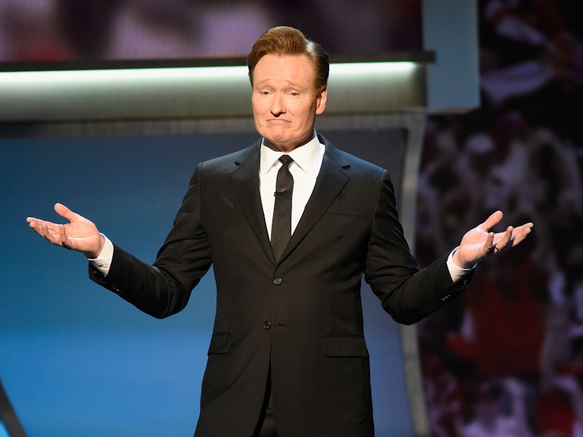 caption: Host Conan O'Brien speaking onstage during the 5th Annual NFL Honors in San Francisco, Calif.