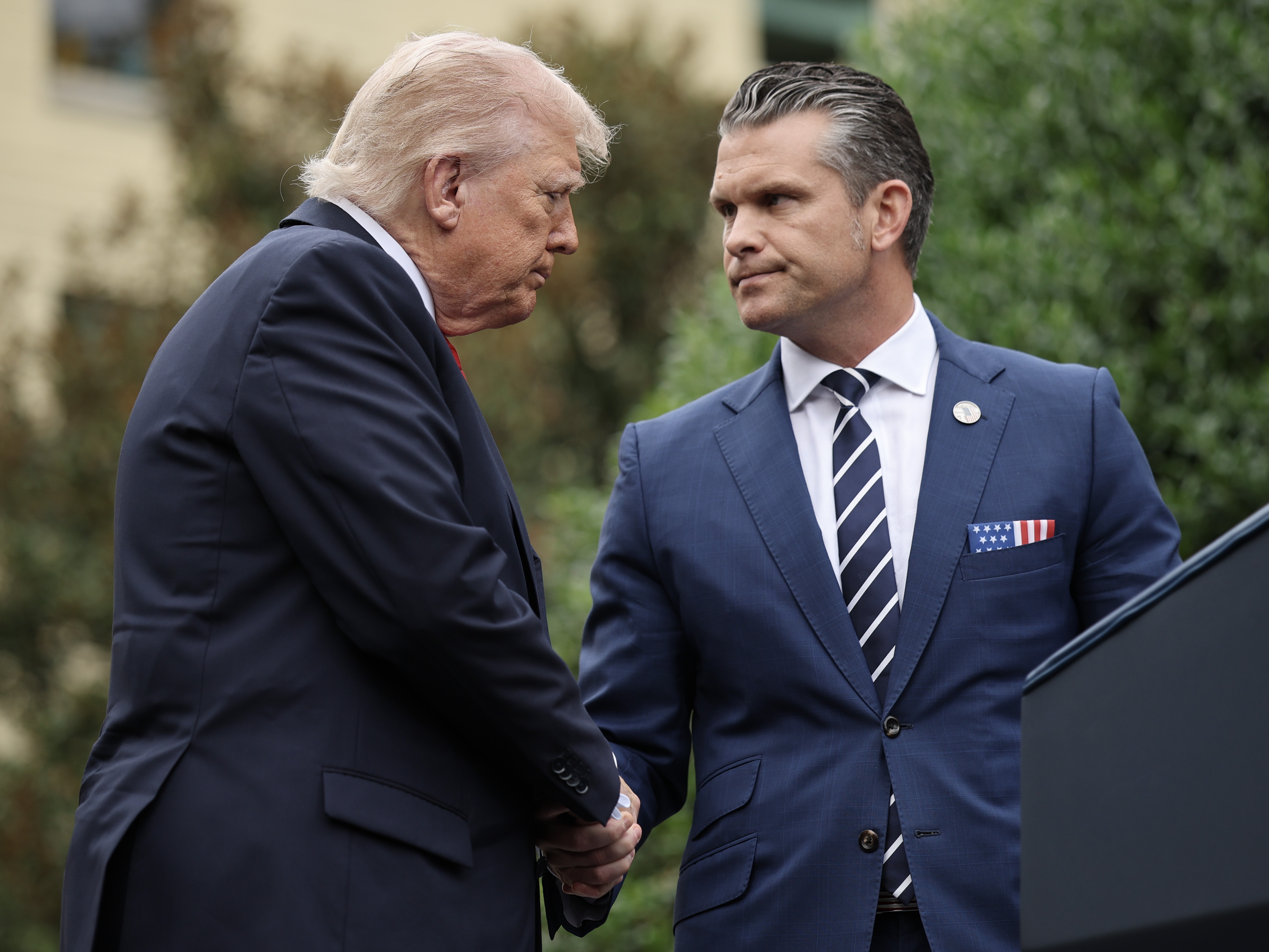 caption: President Trump, seen here with Defense Secretary Pete Hegseth on Sept. 11, will address top military leaders at Quantico, Va., on Tuesday.