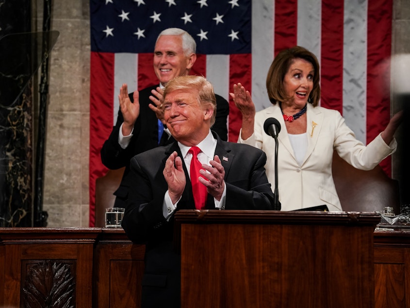 caption: President Donald Trump, Speaker Nancy Pelosi and Vice President Mike Pence applaud during the State of the Union address on February 5, 2019.