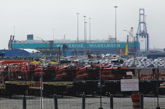 caption: Cars are visible in a general view from the Baltimore Port after the cargo ship Dali ran into and collapsed the Francis Scott Key Bridge in Baltimore, Md., on Tuesday. The accident has temporarily closed the Port of Baltimore, which handles more vehicles per year than any other U.S. port.