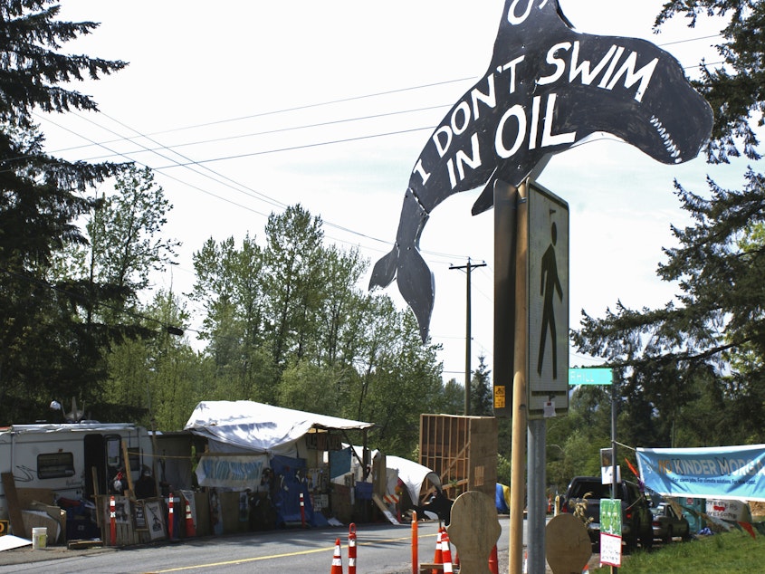 caption: The expansion of the Trans Mountain pipeline has seen significant opposition, such as this camp set up by demonstrators in Vancouver, Canada, in 2018.