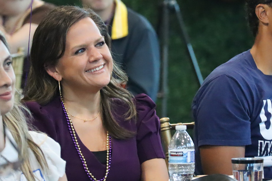 caption:  Rep. Tarra Simmons (D-Bremerton) sits in the crowd listening to a person speak at her celebration event in Bremerton Friday, Sept. 8, 2023, after having her criminal record cleared by a judge earlier that afternoon.