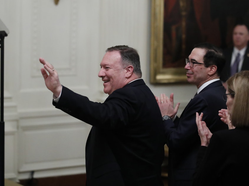 caption: "That reporter couldn't have done too good a job on you yesterday," President Trump told Secretary of State Mike Pompeo Tuesday. He added, "Think you did a good job on her, actually." The remark came as Trump acknowledged Pompeo's role in a White House plan to resolve the Israeli-Palestinian conflict.