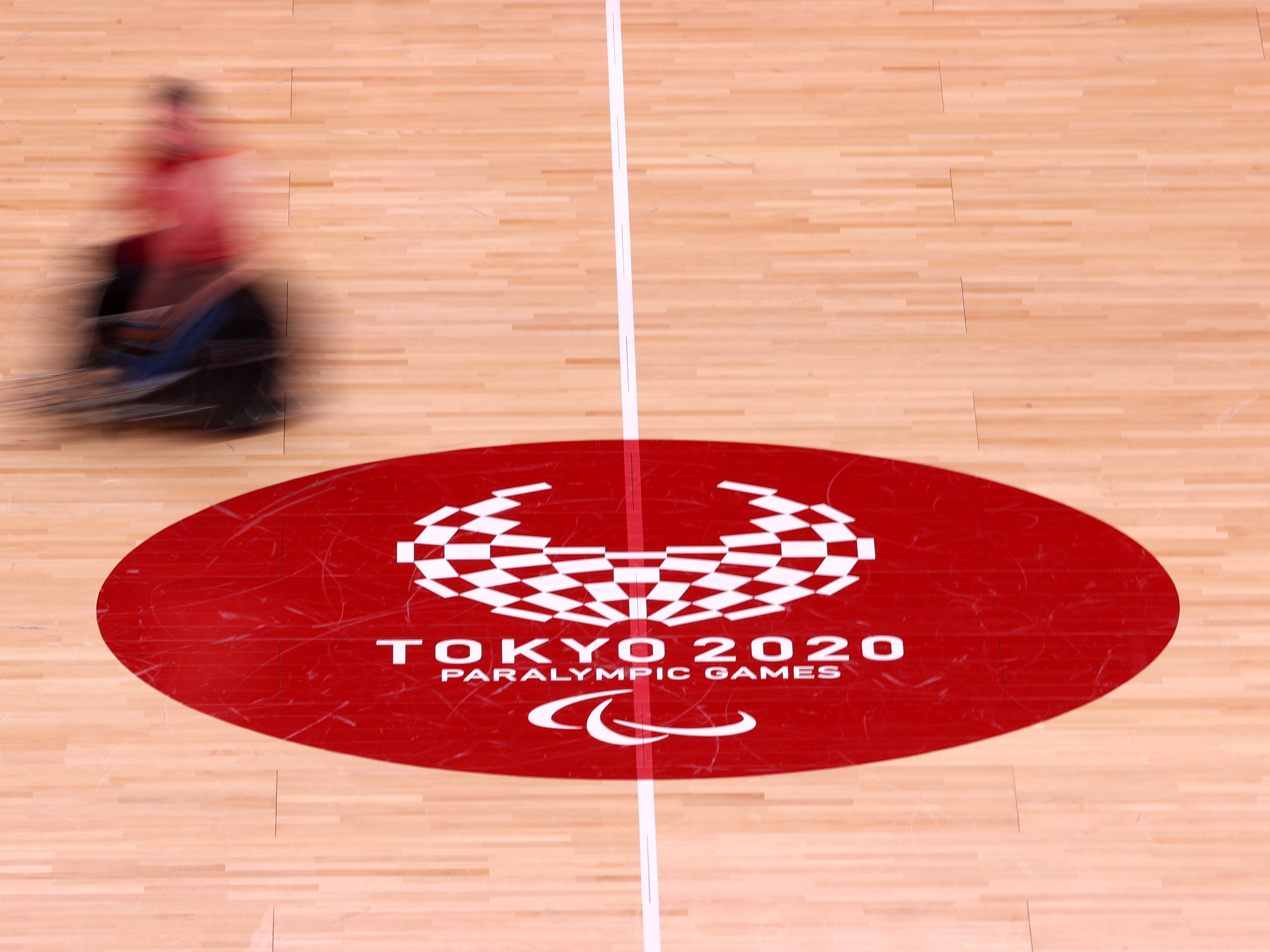 caption: A general view of action during a New Zealand Wheelchair rugby practice session ahead of the Tokyo 2020 Paralympic Games at Yoyogi Sports Arena on August 22, 2021 in Tokyo, Japan.