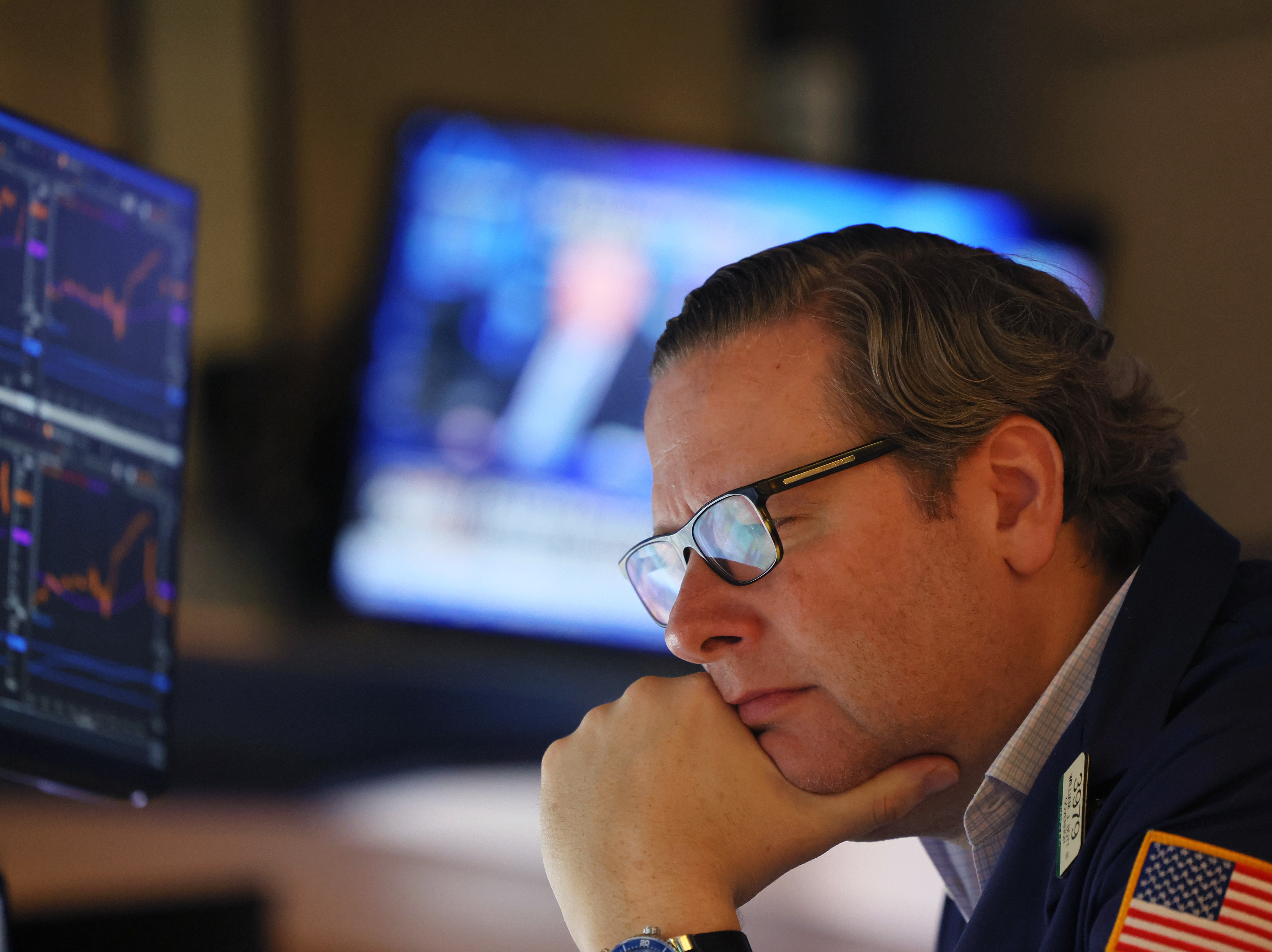 caption: Traders work the floor of the New York Stock Exchange in New York City on Thursday. Stocks fell sharply a day after the Federal Reserve raised interest rates by the most in over two decades.