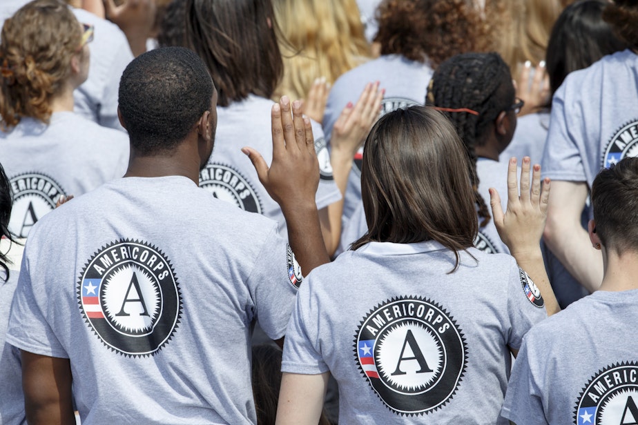 caption: s President Barack Obama and former President Bill Clinton mark the 20th anniversary of the AmeriCorps national service program, hundreds of new volunteers are sworn in for duty at a ceremony, Friday, Sept. 12, 2014, on the South Lawn of the White House in Washington.