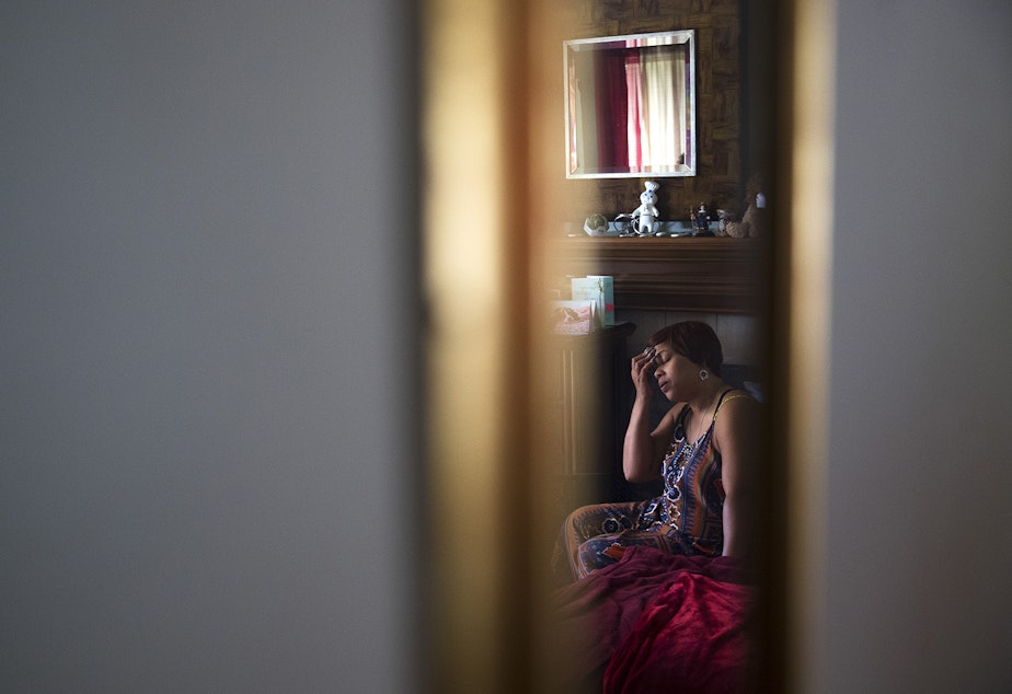 caption: LaDonna Horne is reflected in a mirror as she sits on her son DaShawn Horne's bed after they arrived home from the hospital on Thursday, May 3rd, 2018, at their home in Auburn. “I think I finally just took a deep breath,” LaDonna said. 