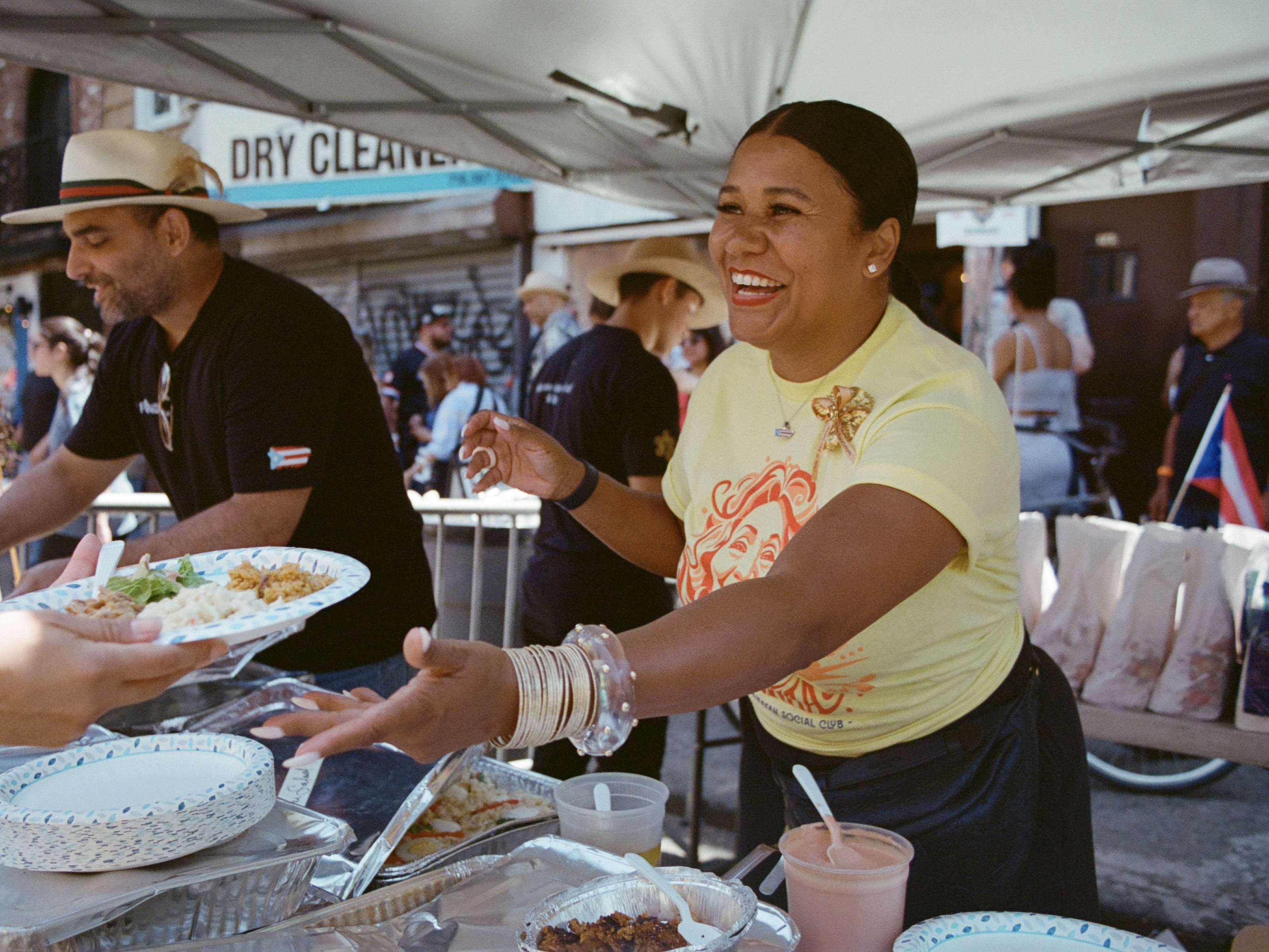 caption: On a recent scorching summer day in Brooklyn, community members turned out in droves to celebrate the 50th anniversary of Toñita's Caribbean Social Club.