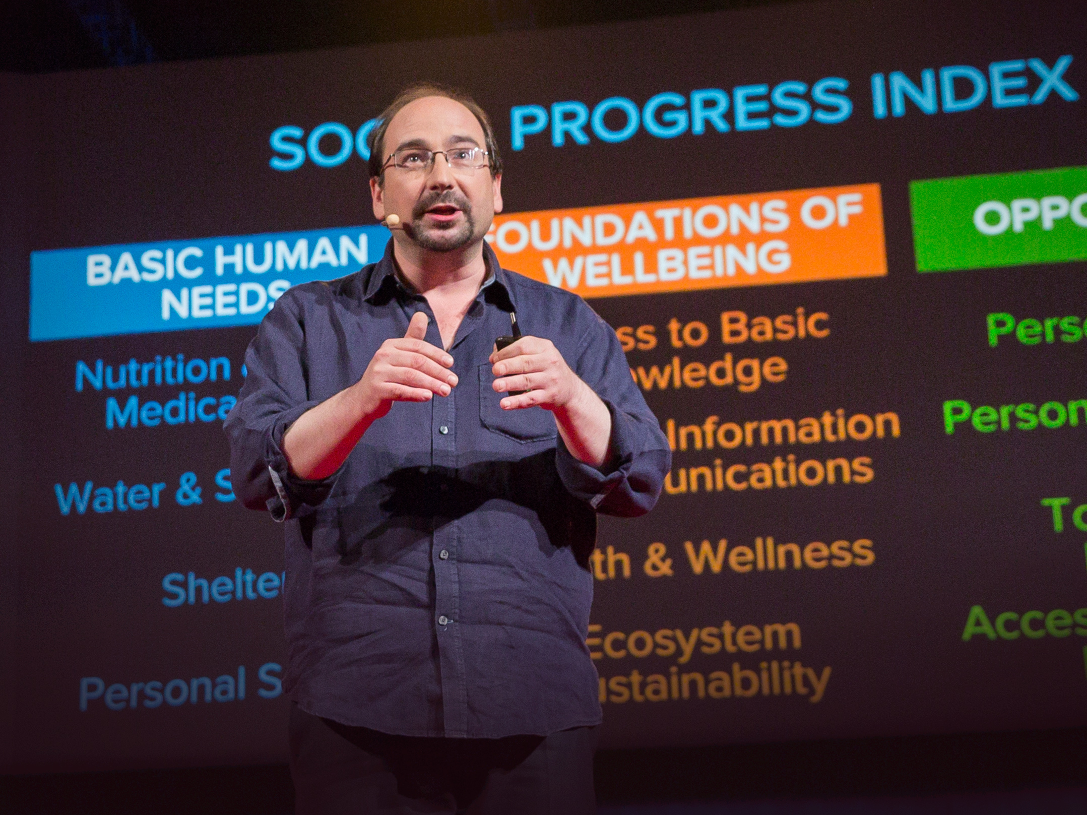 caption: Michael Green on the TED stage.
