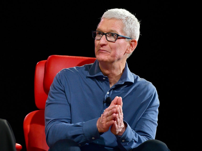 caption: Apple CEO Tim Cook speaks onstage during Vox Media's 2022 Code Conference in Beverly Hills, Calif.