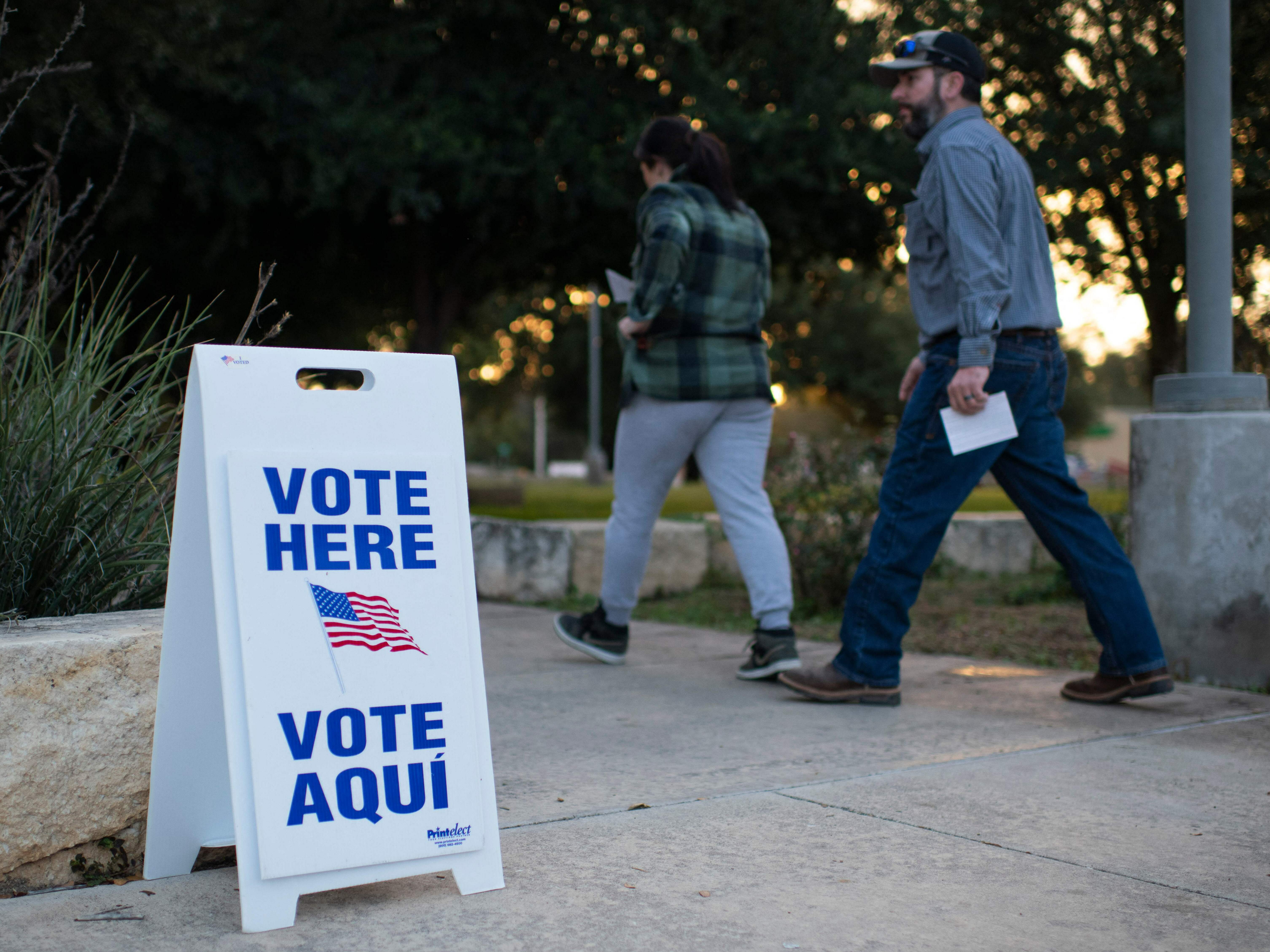 caption: Voters walk into a polling place in Uvalde, Texas, on Nov. 8, 2022.