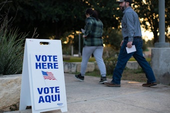 caption: Voters walk into a polling place in Uvalde, Texas, on Nov. 8, 2022.