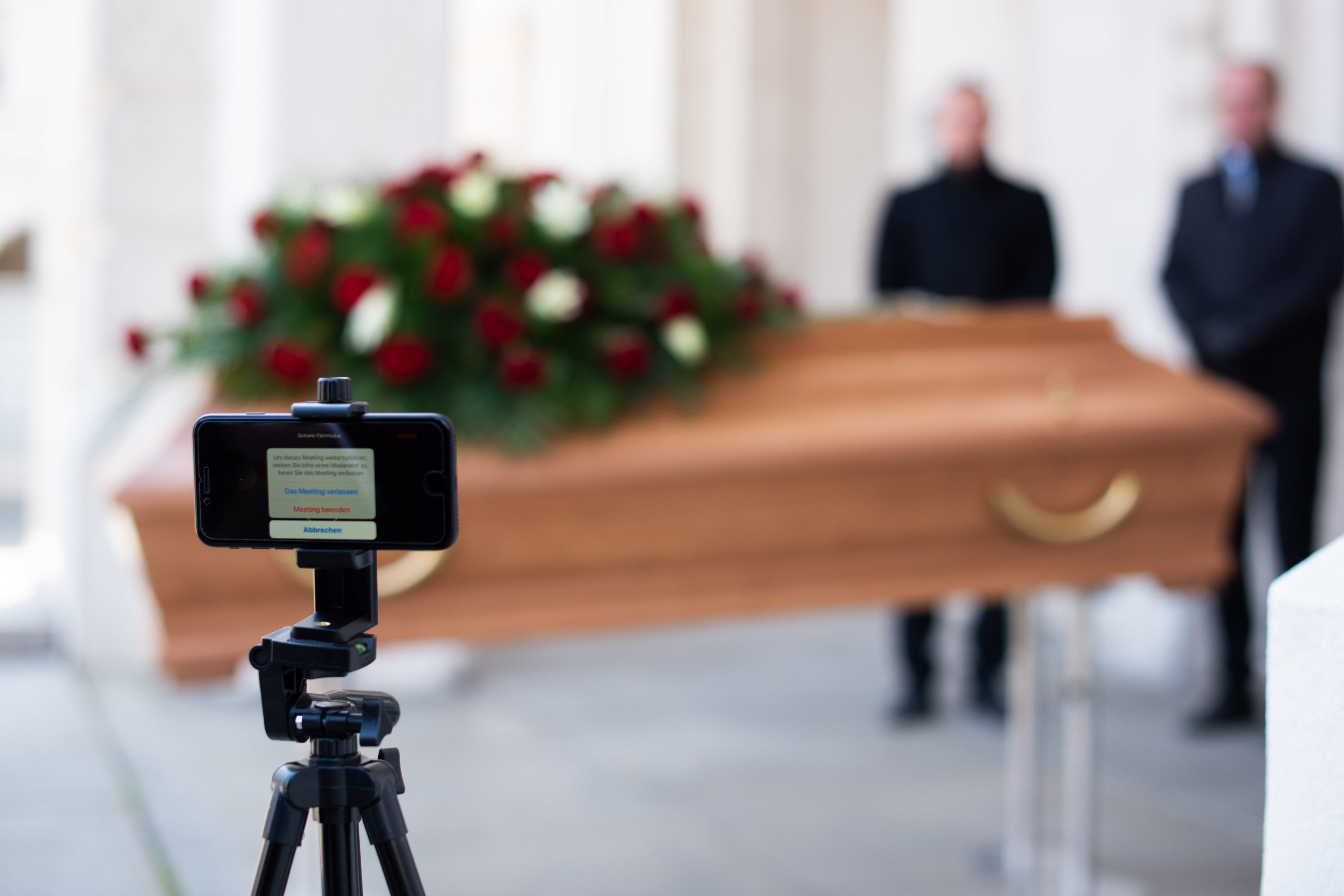 caption: Undertakers rehearsing a live streamed funeral. (Thomas Kronsteiner/Getty Images)