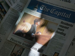 caption: <em>Capital Gazette </em>journalists became subjects of news stories connected to the shooting. Reporter Rachael Pacella landed on the <em>Capital Gazette's</em> front page for testifying at the Maryland State House about gun violence.