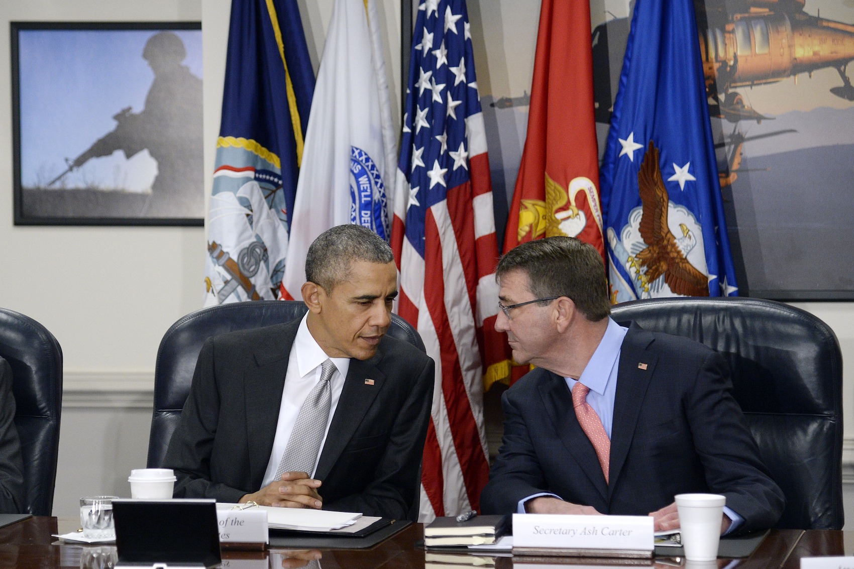 caption: President Barack Obama (left) and U.S. Defense Secretary Ash Carter talk during a national security council meeting on the counter-ISIL campaign at the Pentagon Dec. 14, 2015 in Arlington, Va. (Olivier Douliery-Pool/Getty Images)