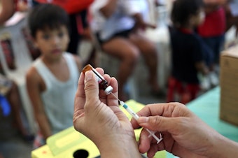 caption: A measles vaccination campaign in Manila this year. That vaccine is believed to confer an additional benefit beyond immunity to the virus. Vaccinations against other diseases — polio, tuberculosis, typhoid — may also confer an unintended protection.
