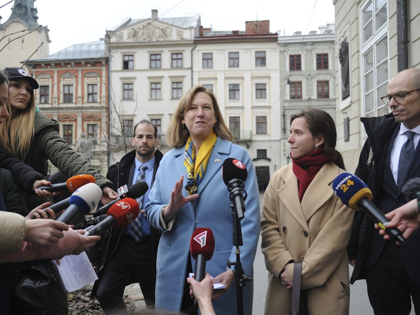 caption: The acting U.S. ambassador to Ukraine, Kristina Kvien, speaks to media in Lviv, Ukraine, on Tuesday. The U.S. has relocated the embassy from the capital Kyiv to the western city of Lviv, citing the buildup of Russian forces on Ukraine's borders. An estimated 20,000 or more Americans have been living in Ukraine. Many have left, but some say they'll remain even if war breaks out.